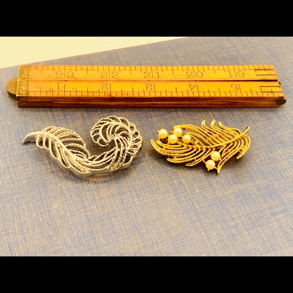 Two vintage feather leaf brooches gold silver pins